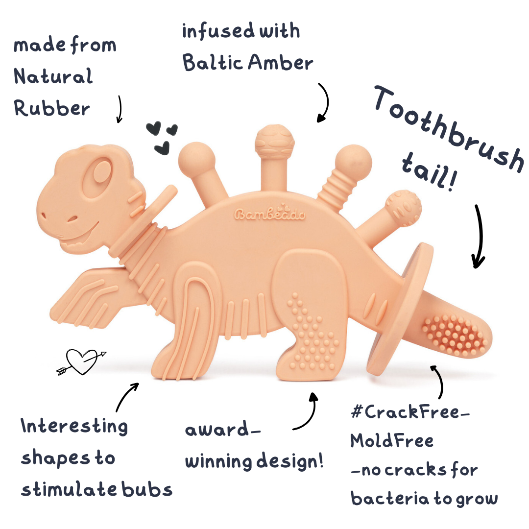 Dinosaur-shaped rubber teether with text highlighting features on a white background