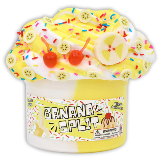 Banana-scented slime jar with yellow slime, fruit slices, sprinkles, and red cherry charms