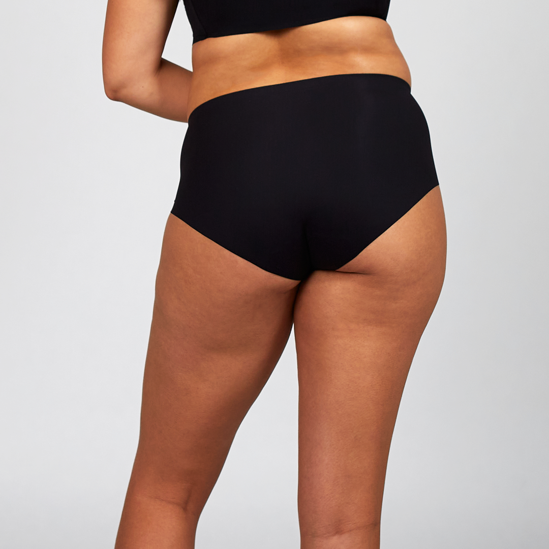 Black high-waist brief on body with smooth front and wide waistband.