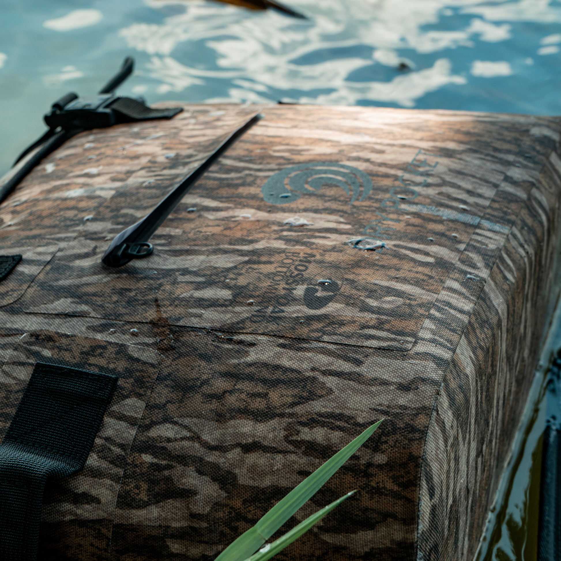 Mossy oak camo waterproof floating cooler bag on the water surface