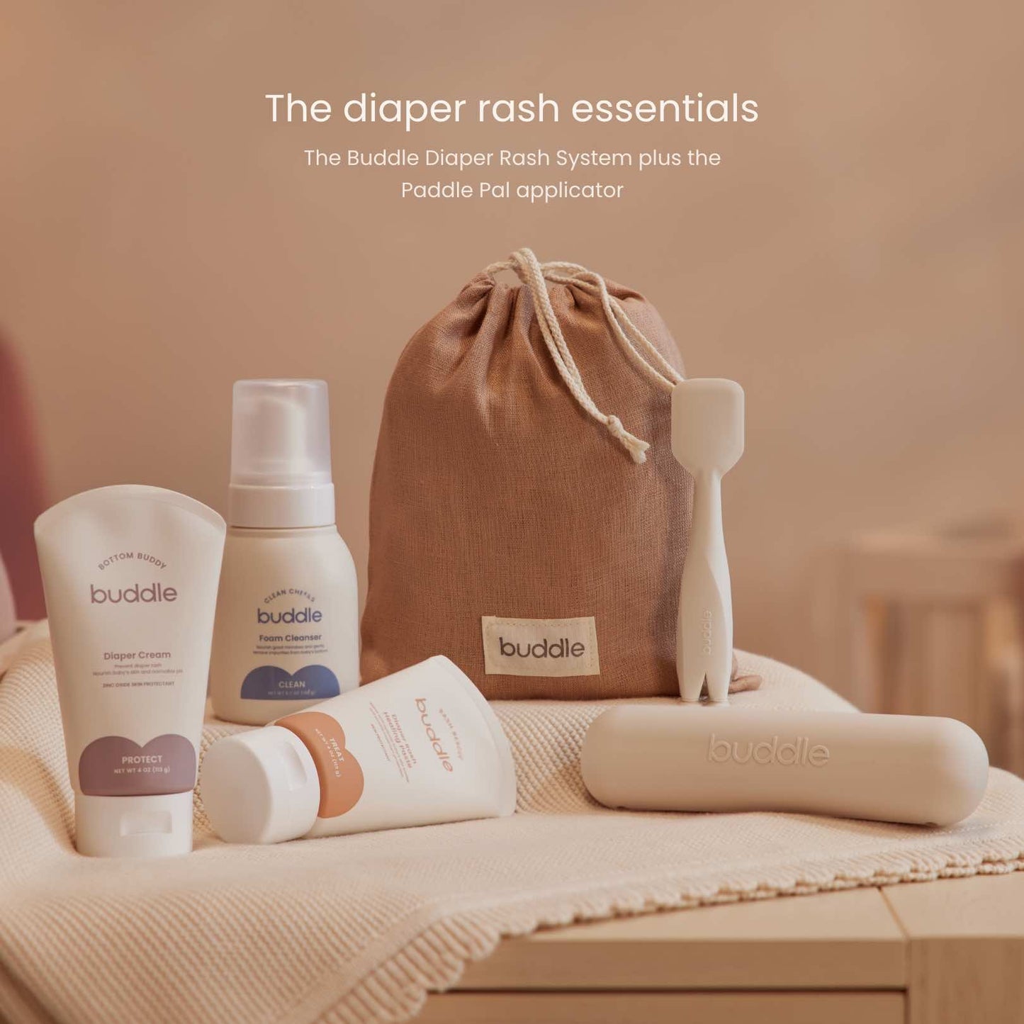 Diaper rash system essentials kit with drawstring linen bag, bottles, tubes, and applicator