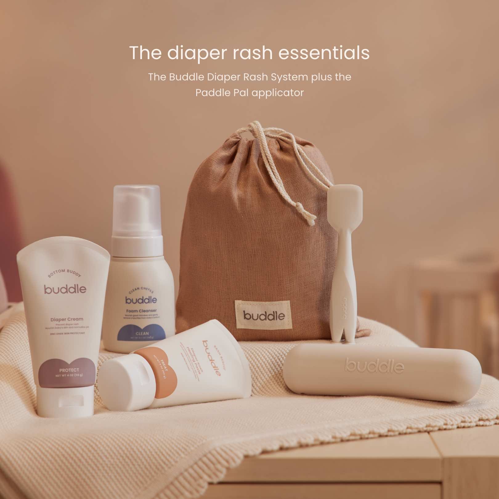Diaper rash system essentials kit with drawstring linen bag, bottles, tubes, and applicator