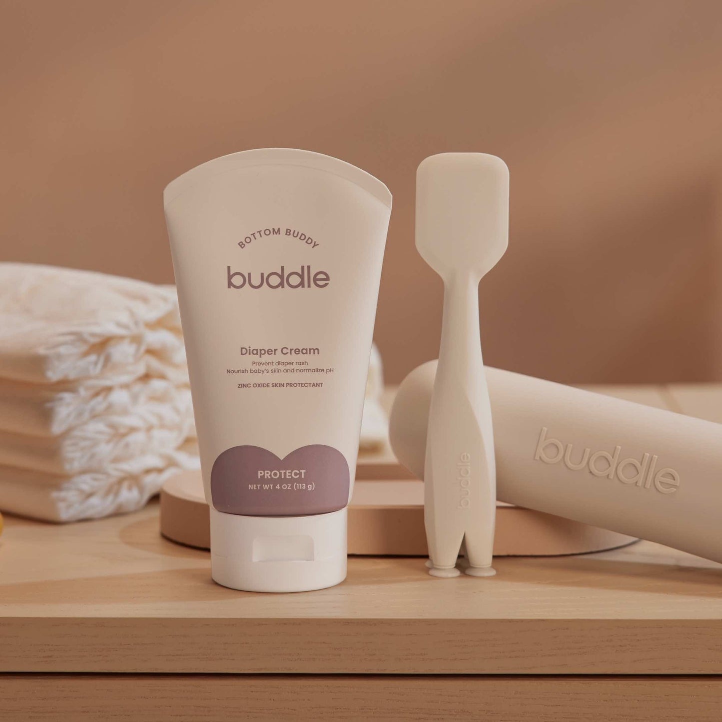 Diaper cream tube with silicone applicator, shown with pump-style nozzle