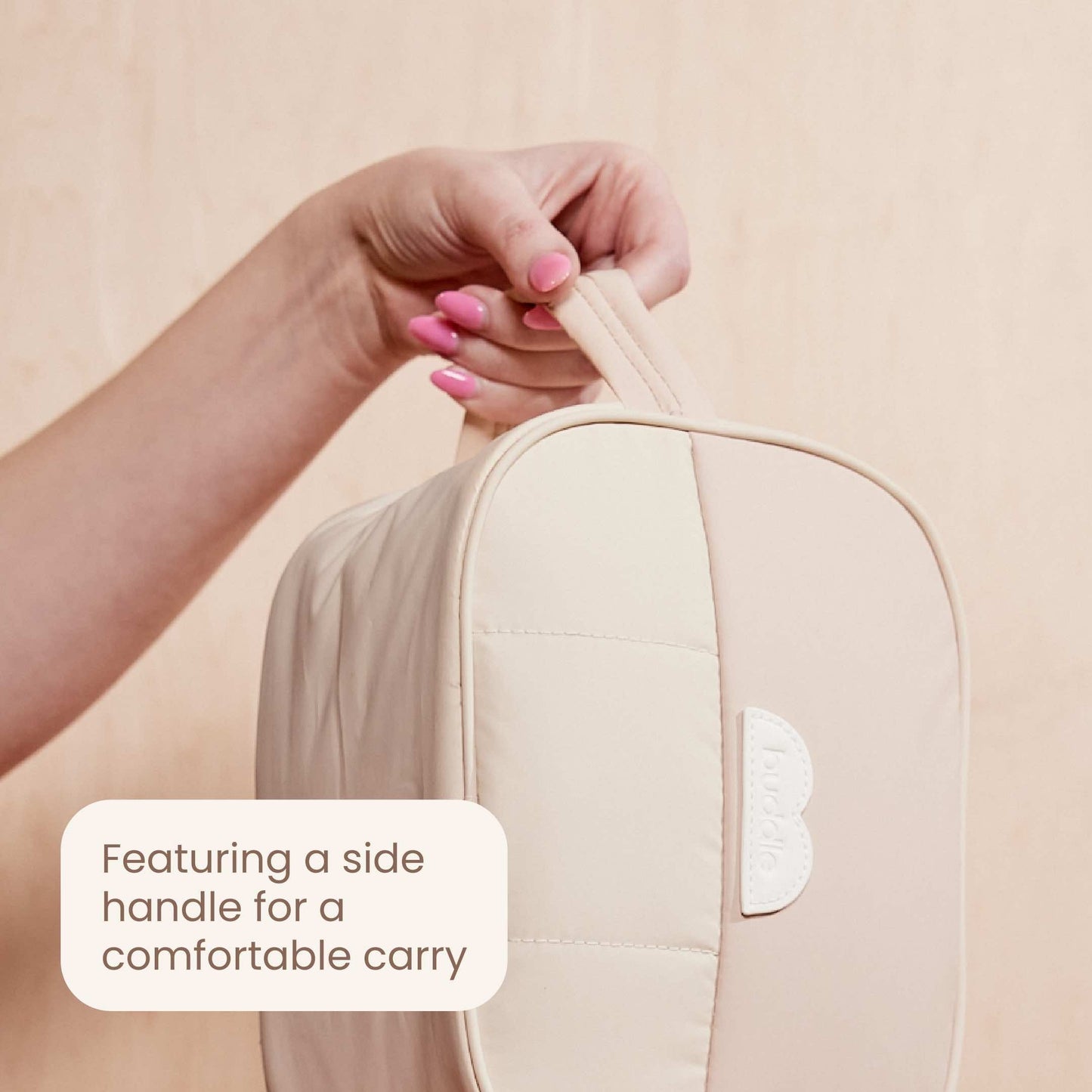 Light beige bum bag with side handle and embossed logo tab