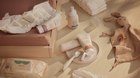 Diaper rash system essentials kit products laid out: cleanser, cream, paste, applicator