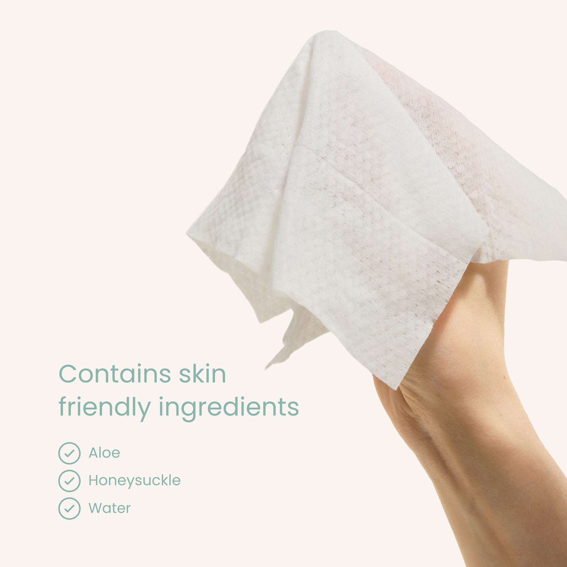 Baby wipe held in hand, white wipe sheet