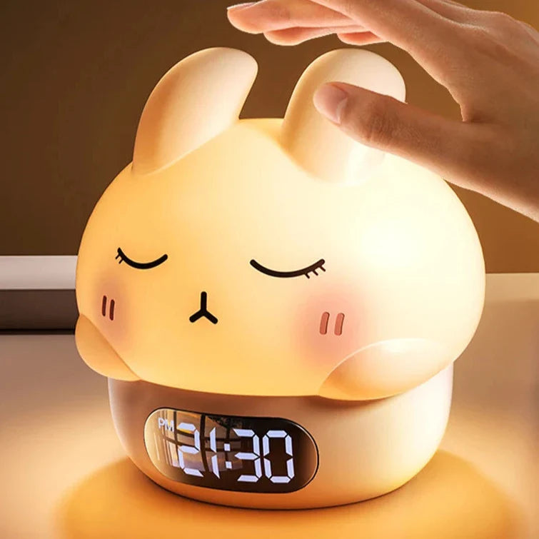 Glowing bunny night light alarm clock with smiling face and 4:30 LED display.