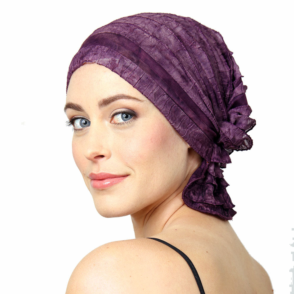 Purple chemo beanie cap with ruched stripes and side bow