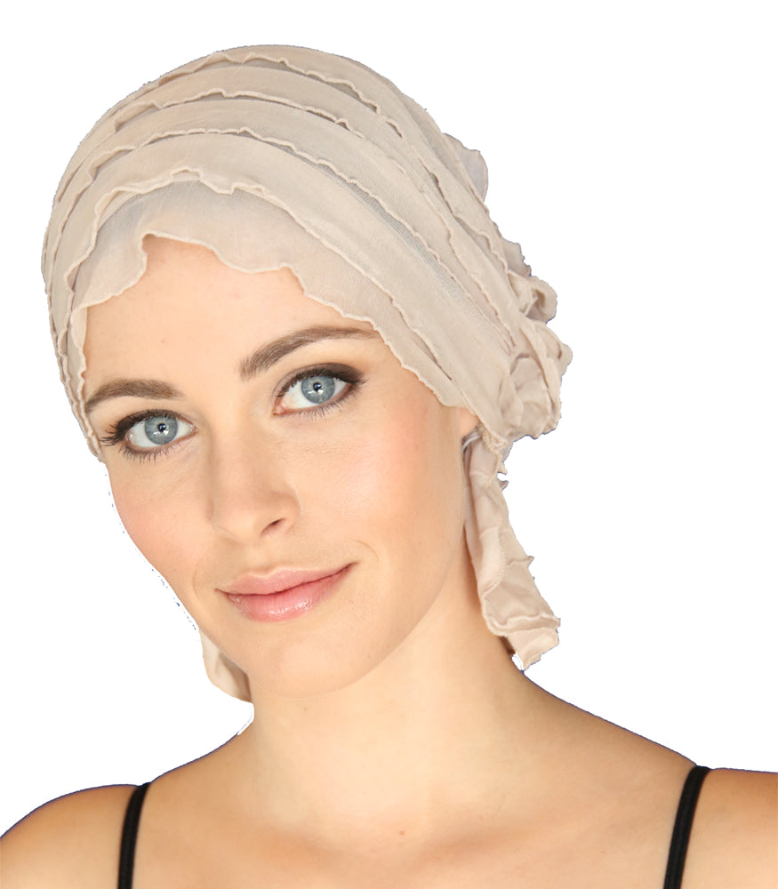 Beige ruffled headscarf, close-up of folds and layered trim