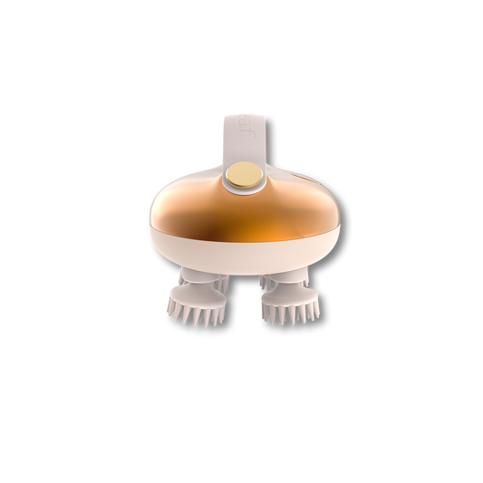 Gold scalp massager with two rows of white bristles and a circular top power button
