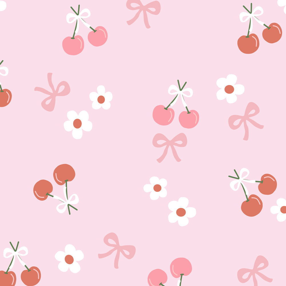 Pink fabric with orange cherry and flower print, close-up pattern