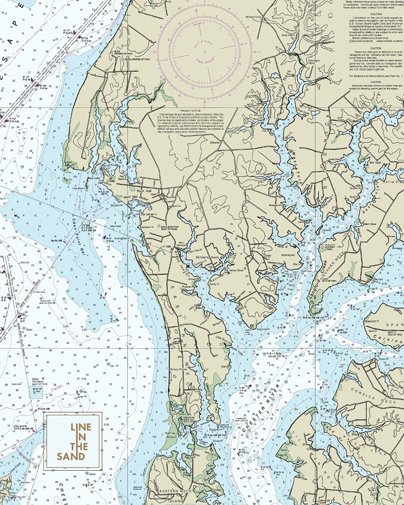 Nautical chart print fabric with coastline, pale blue waters, circular depth marks, and “LINE IN THE SAND” logo