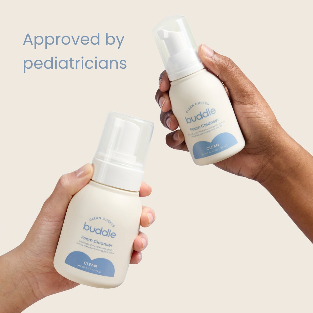 Foam cleanser bottles held in hands, white pumps and blue clean label.