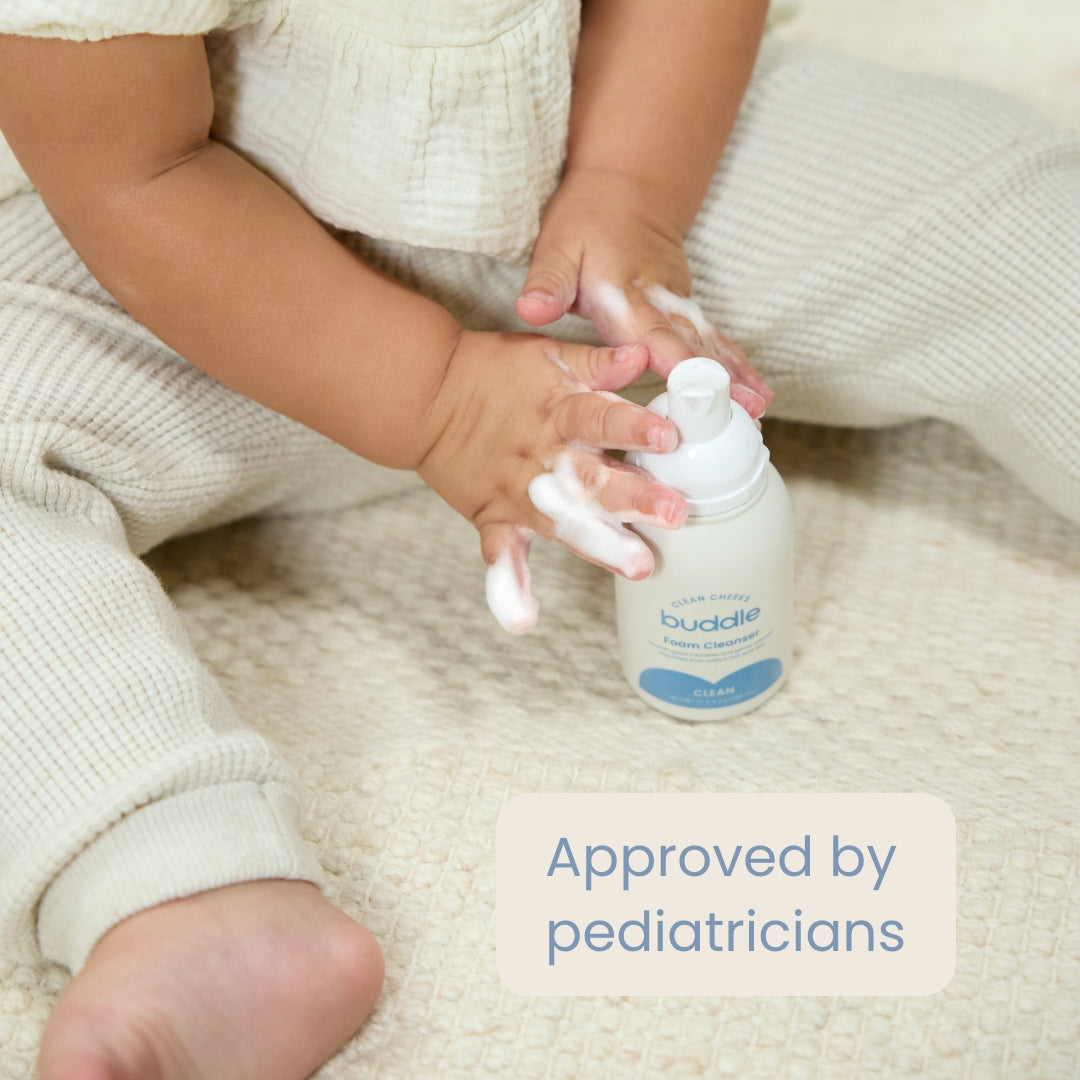 buddle foam cleanser being pumped over a child’s hands
