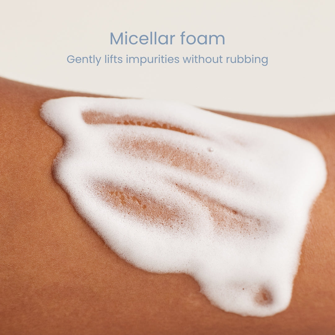 Foamy cleanser lather spread on forearm skin