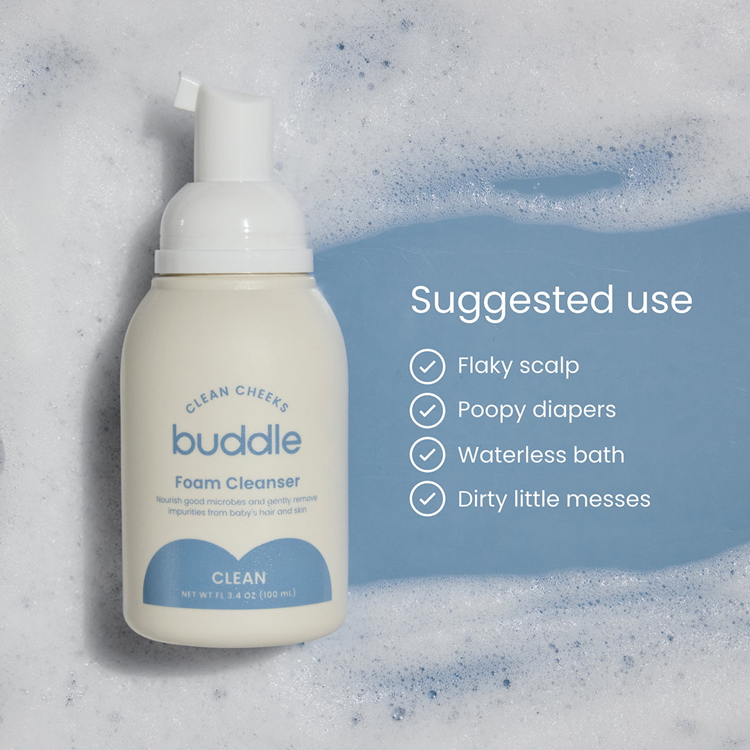 Foam cleanser bottle on water splash, white pump with blue label.