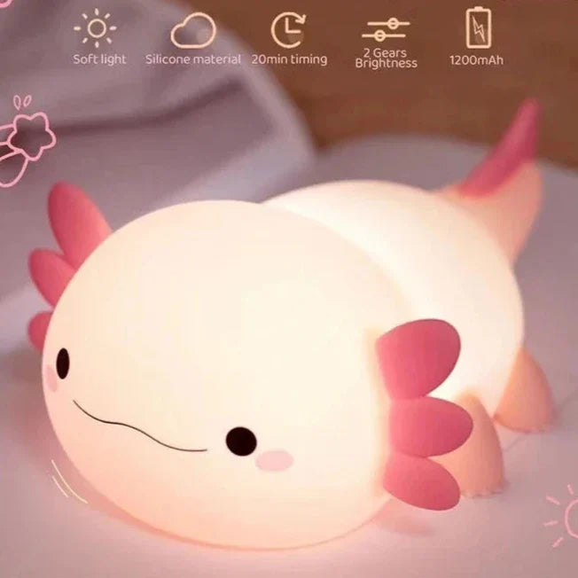 Cream axolotl silicone night light with pink fins, soft warm glow, smiling face