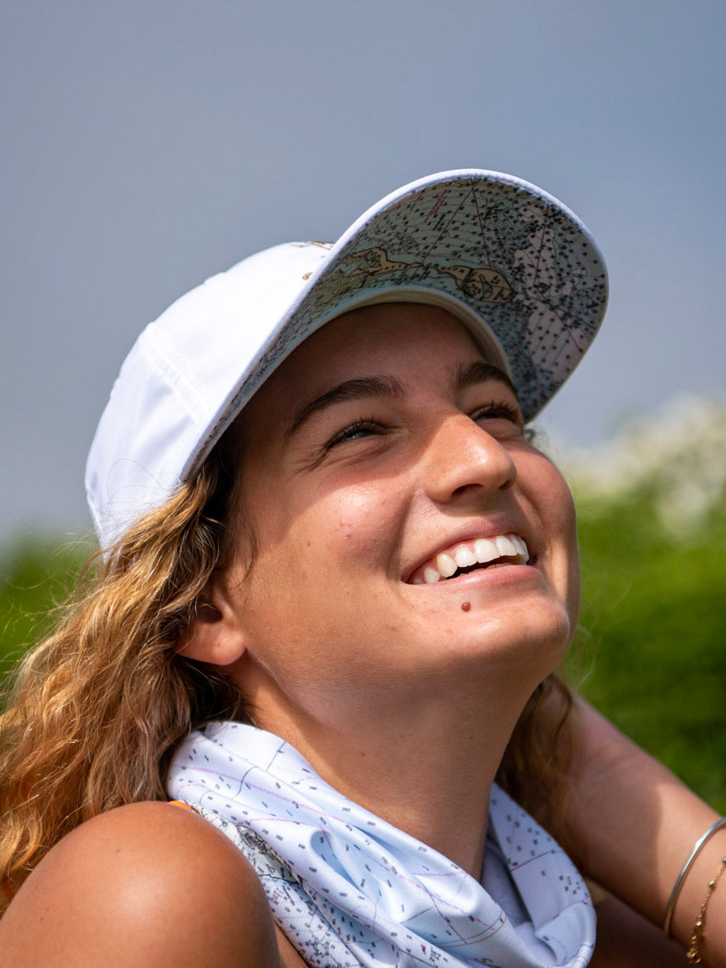 Solar gaiter with white nautical chart print tucked around chin