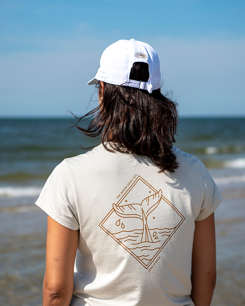 Sand crewneck T-shirt back view with whale diamond graphic and Line in the Sand text