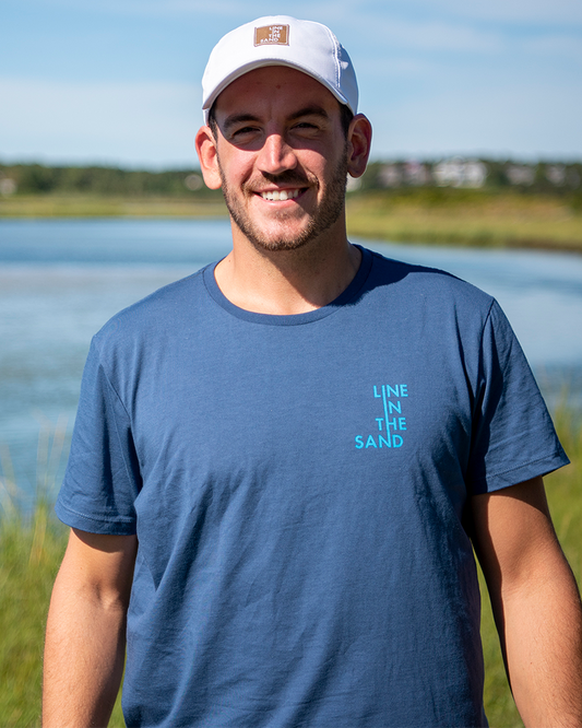 Unisex faded navy wave T-shirt with small front logo graphic in teal