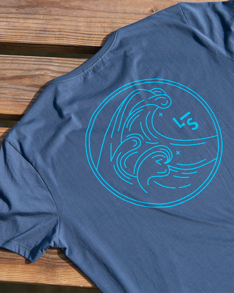 Unisex faded navy wave T-shirt sleeve with teal line-art wave graphic