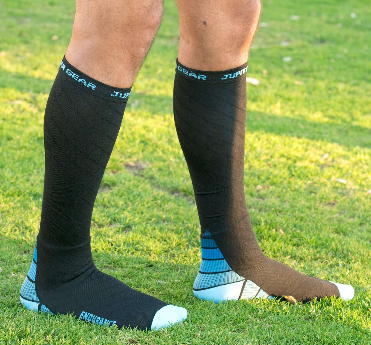Dark compression socks with blue stripe detail and light blue toe/heel