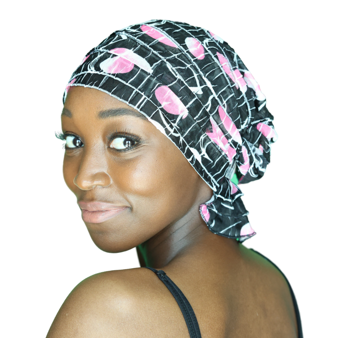 Black chemo beanie with pink and white floral plaid pattern, soft gathered brim