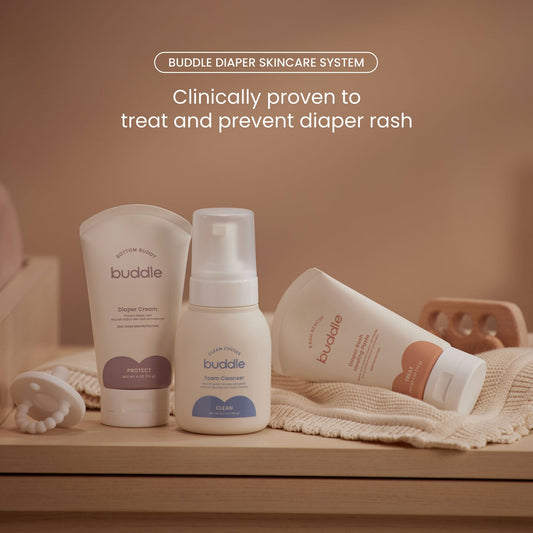 Diaper skincare system bottles and foam cleanser with towel on display