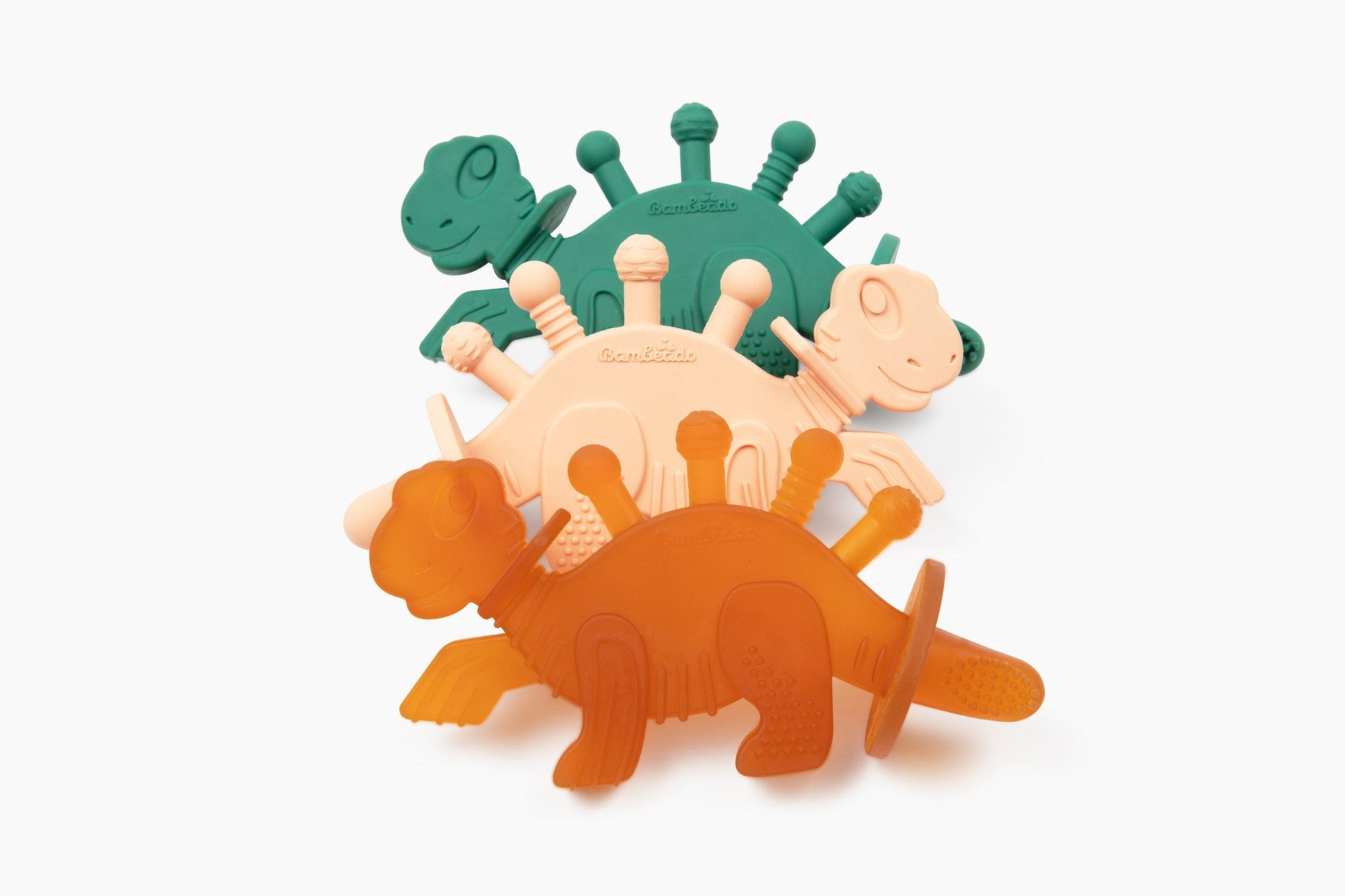Set of colorful dinosaur-shaped bath toys on a white background