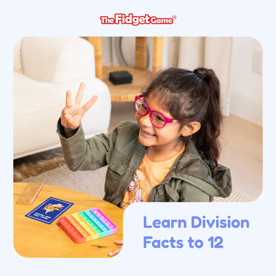 Division flashcards on a table with a blue card deck for learning division facts