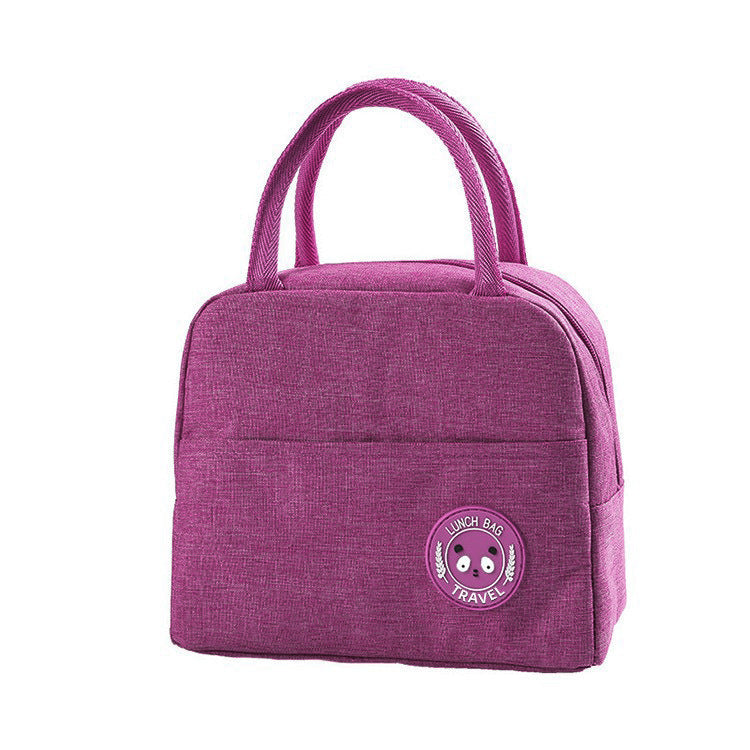 Purple insulated lunch bag with top handles and round bear logo patch on the front.