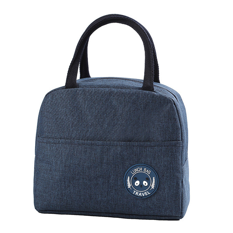 Blue insulated lunch bag with top handles and round bear logo patch on the front.