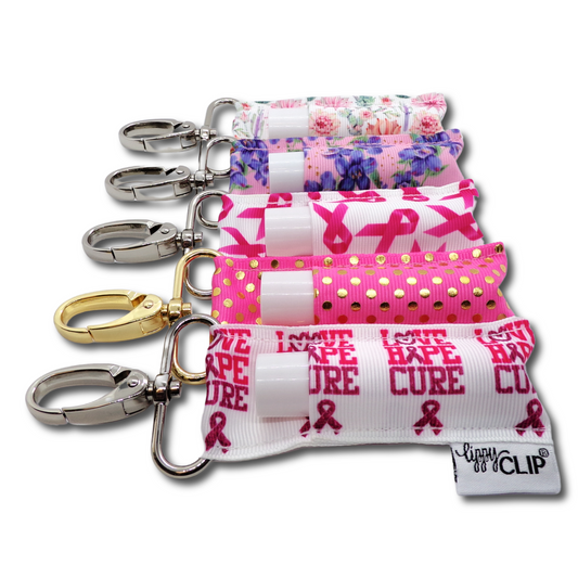 Set of colorful keychains with floral, polka dot, and 'Hope Cure' designs on a white background.