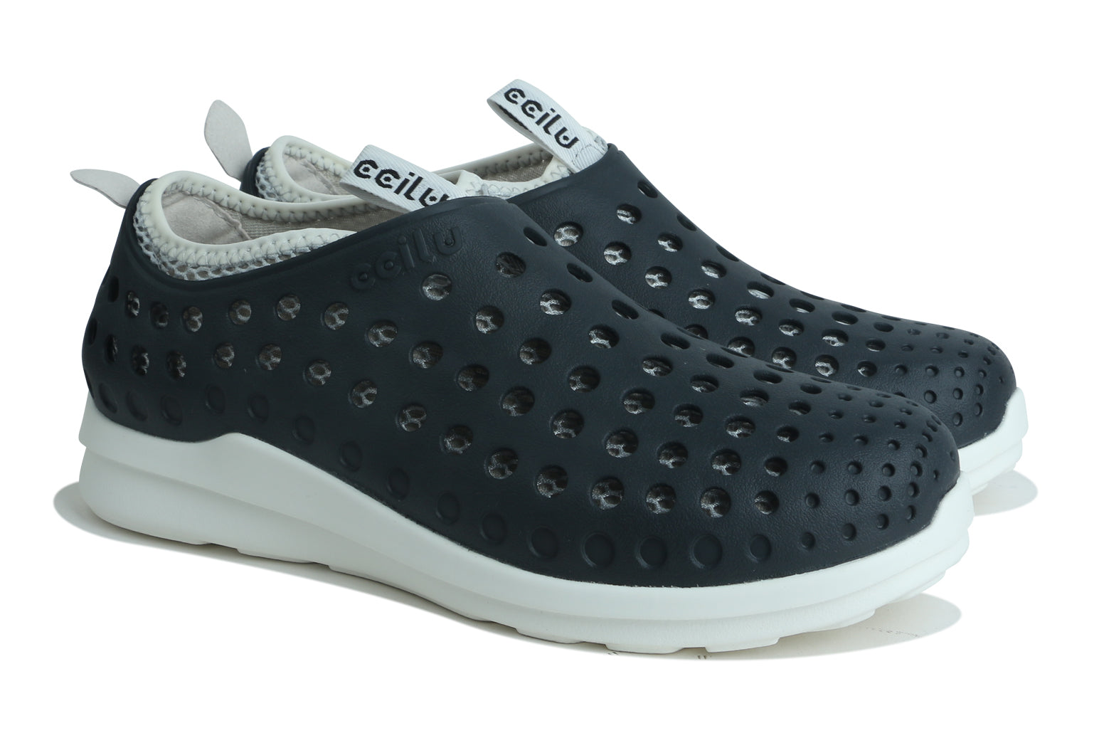 Black slip-on men’s water shoes with perforated upper, white sole, and gray collar