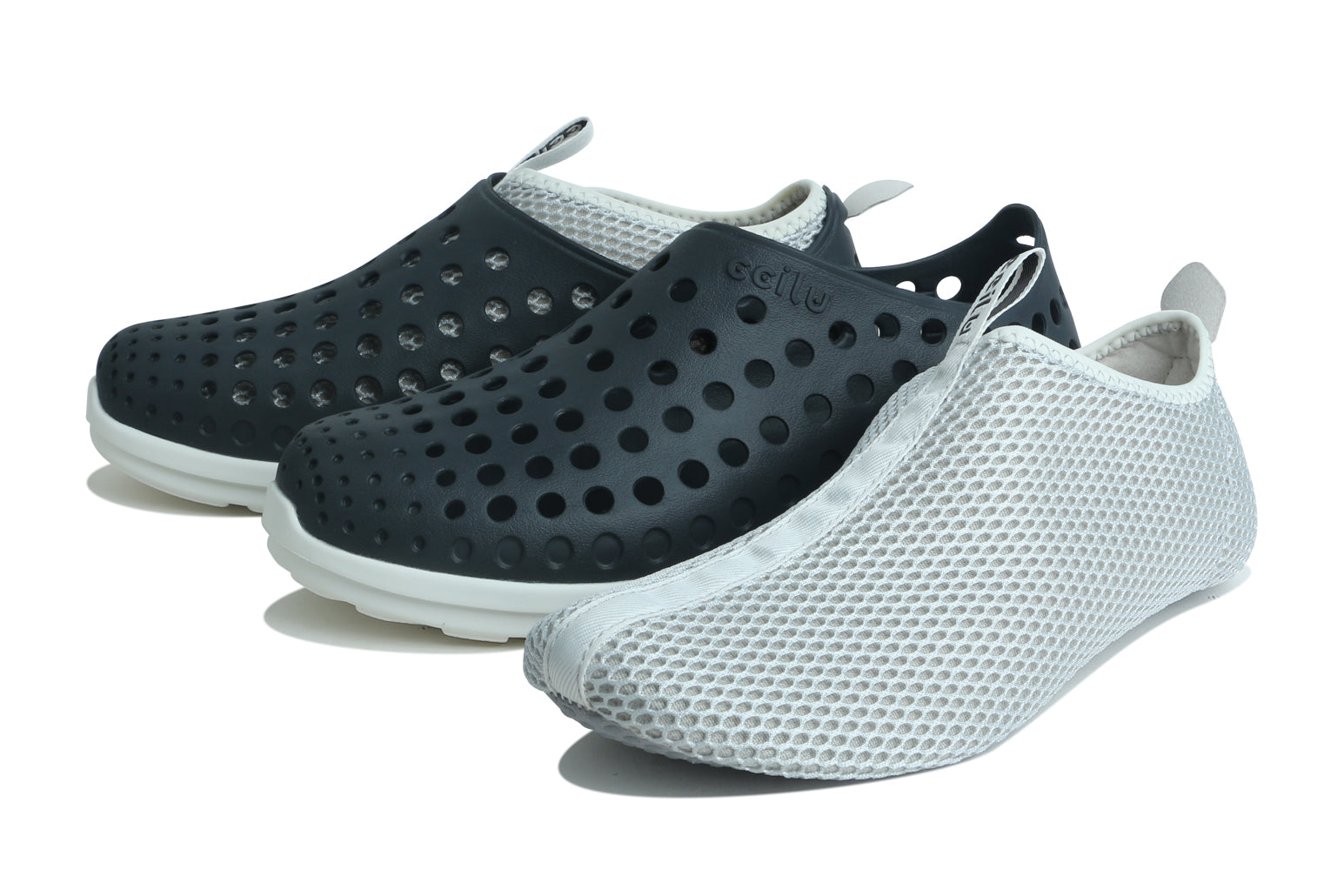 Pair of black slip-on water shoes with perforations, white lining, and thick sole