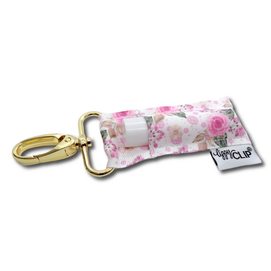 Keychain with floral design holder for lip balm on a white background