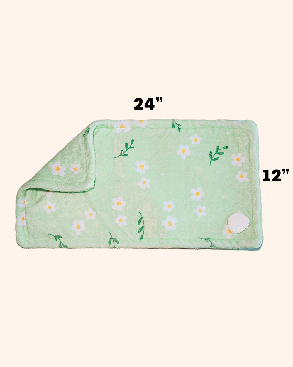 Mint green floral heating pad folded flat, white daisy flowers with yellow centers