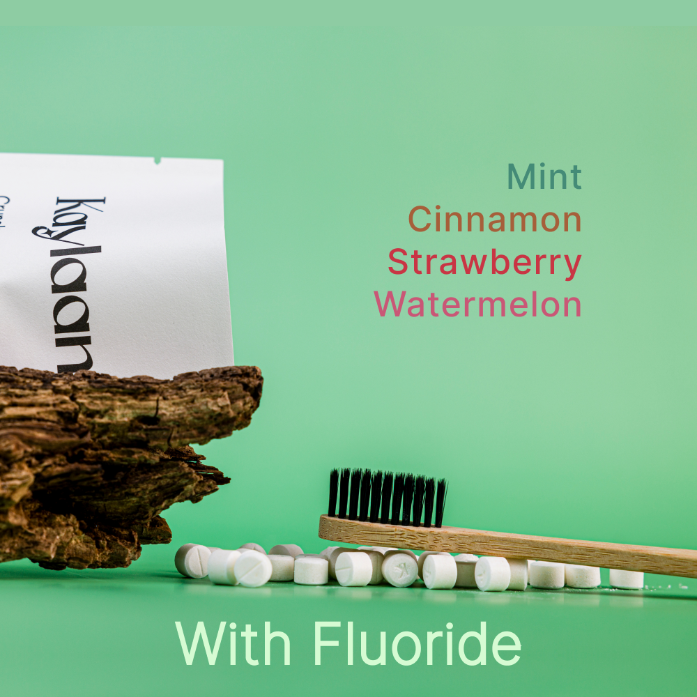 Fluoride toothpaste tablets trial pack pouch with tablets and wooden-handled toothbrush