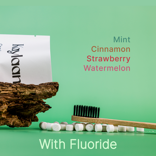 Fluoride toothpaste tablets trial pack pouch with tablets and wooden-handled toothbrush