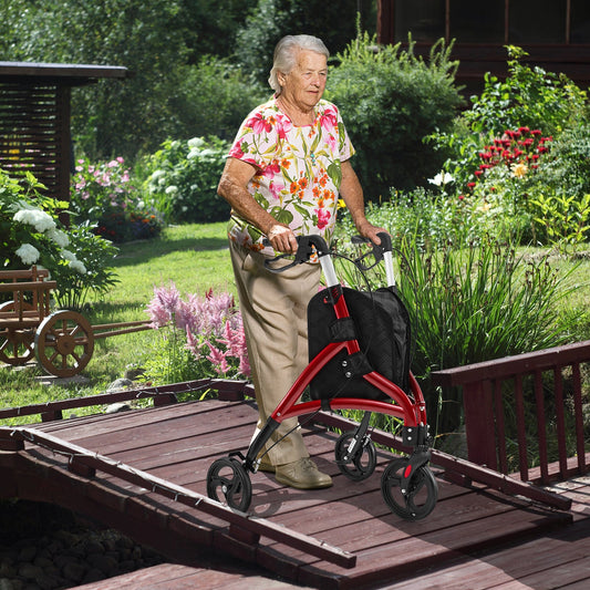Senior woman using a red rollator in a garden setting