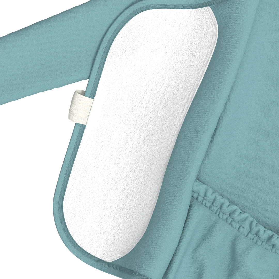 Close-up of a teal baby carrier with white padding on a white background