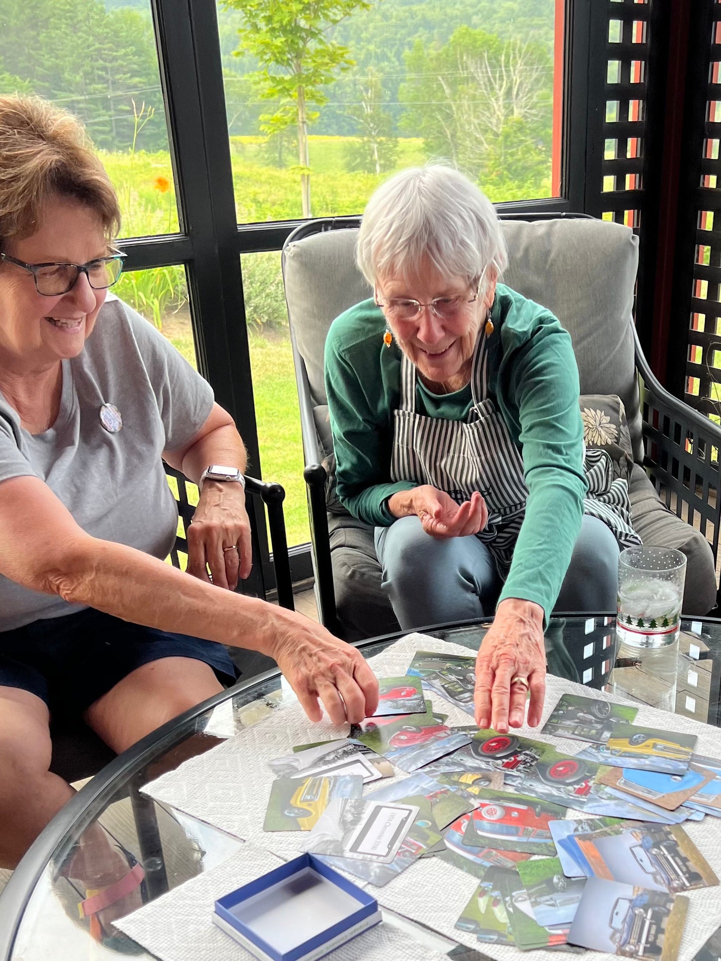 Dementia activity cards spread on a table during play session