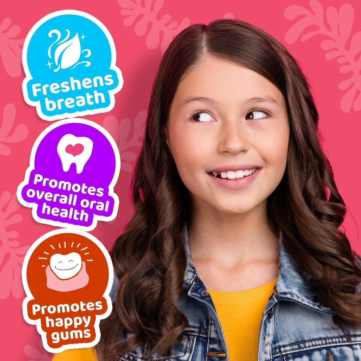 Smiling child holding Kids Bubble-Berry oil pulling oral rinse bottle