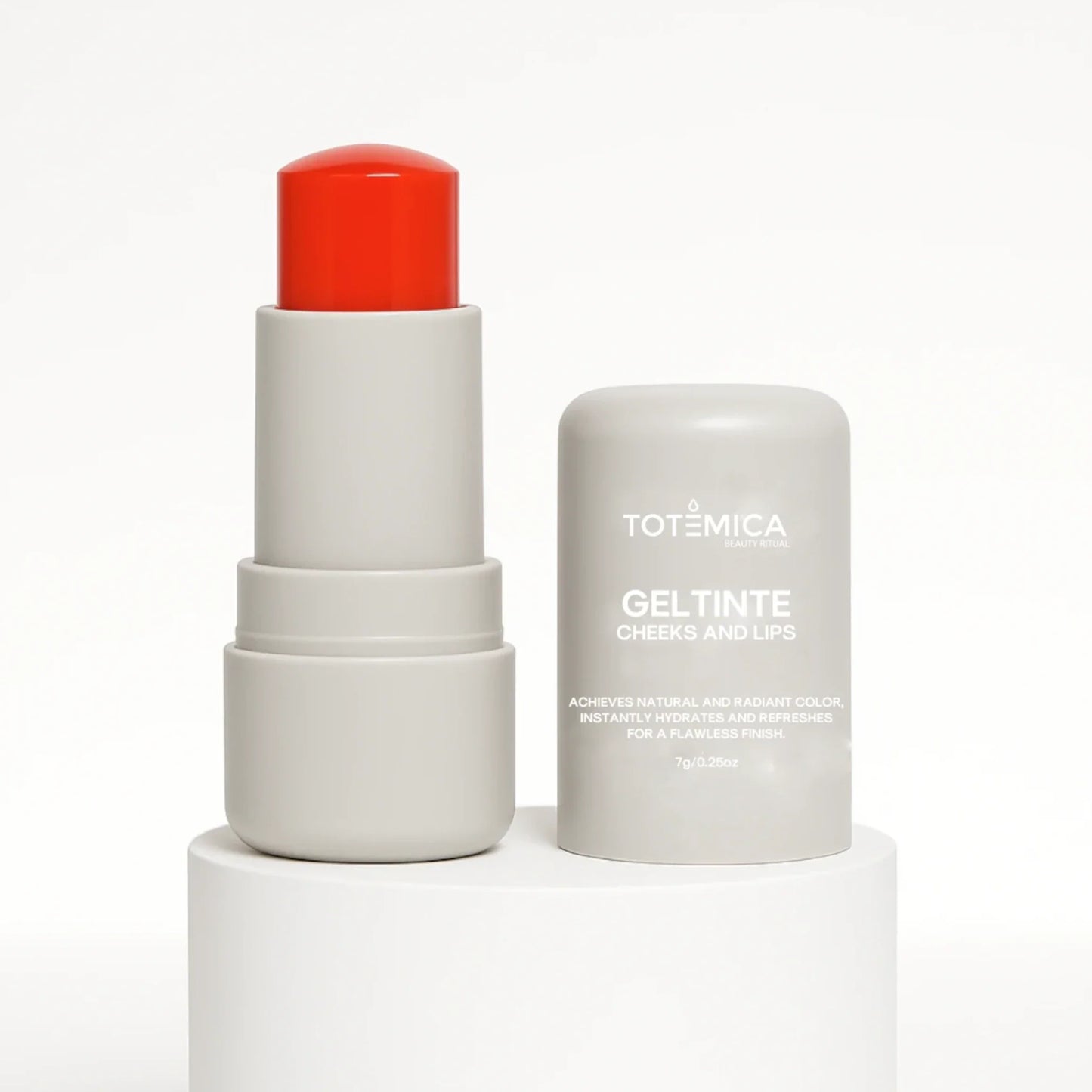 Gel tint for cheeks and lips with red cap, white tube and cylindrical container