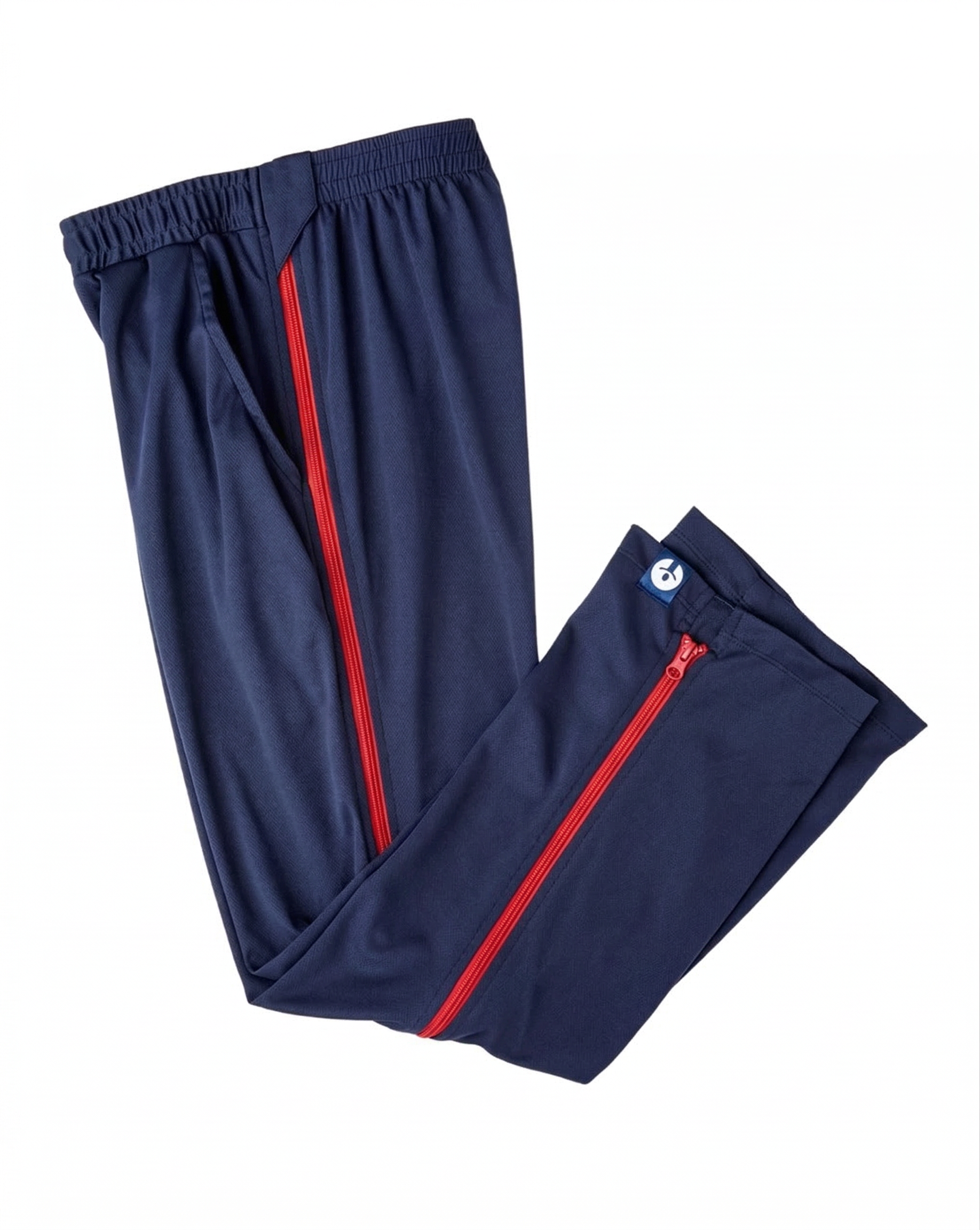 Navy blue pants with red zippers on a white background