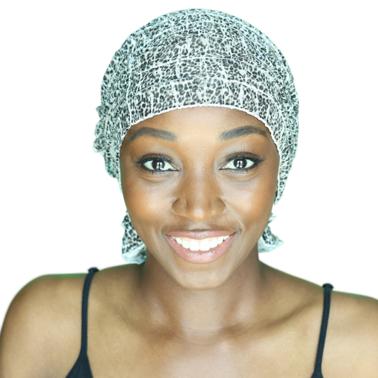 Leopard-print head wrap with ruffled edge, speckled black and white pattern