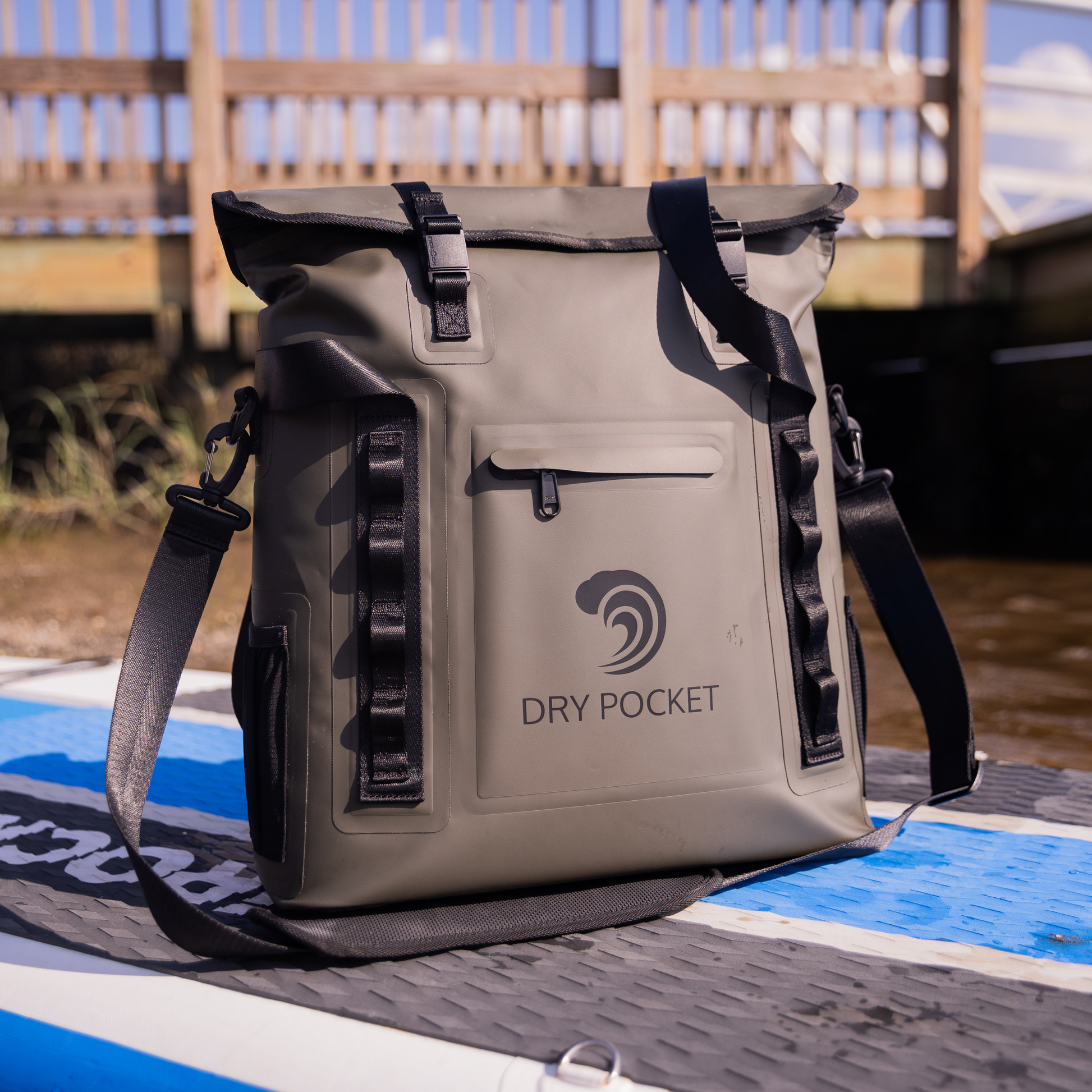 Waterproof floating tote cooler front view with dry pocket logo on tan waterproof fabric