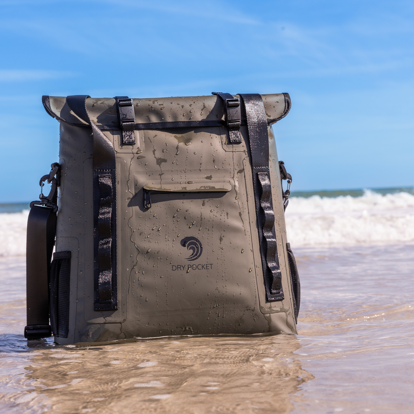 Waterproof floating tote cooler with water droplets on tan fabric and dark straps