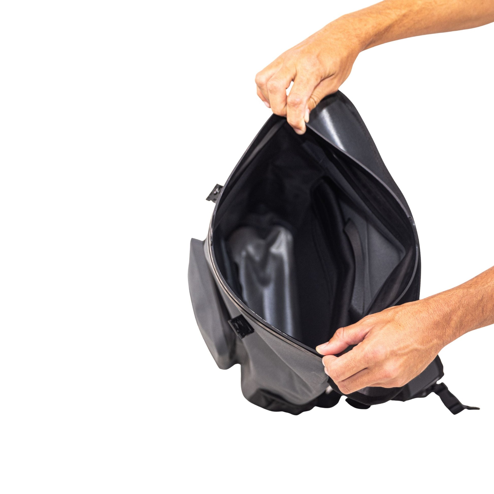 Grey waterproof floating dry backpack open, showing black interior lining
