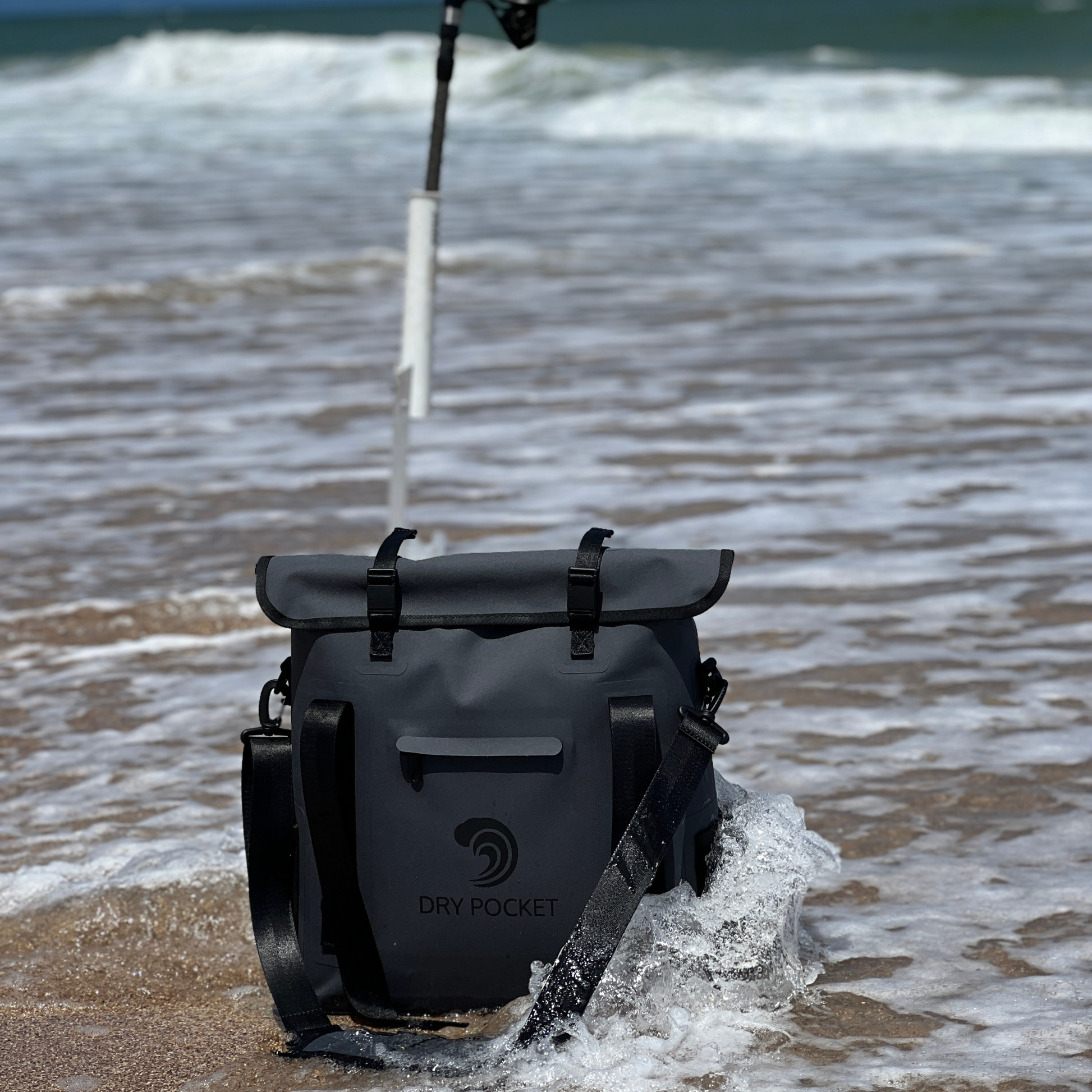 Waterproof floating tote cooler in wet sand, dark gray with front pocket and side buckles
